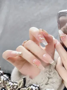 Macro detail of cat eye long coffin press-on nails with silver french tips and rhinestones
