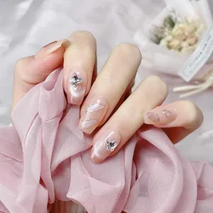 Handmade short press-on nails with cat-eye pink gradient and 3D silver butterfly charms
