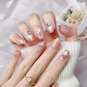 Short square pink cat-eye press-on nails with 3D silver bows and glitter details
