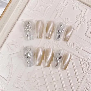 Handmade champagne cat eye coffin nails with sparkling rhinestones and silver accents