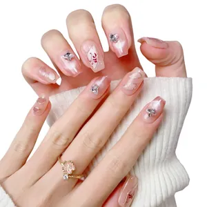 Handmade short press-on nails with pink cat-eye effect and silver 3D butterfly charms