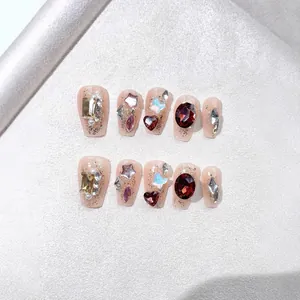 Sparkly handmade press-on nails with 3D aurora butterflies and red rhinestones