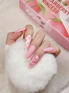 Detail of pink matte ballerina nails featuring checkered pattern and 3D bunny decor