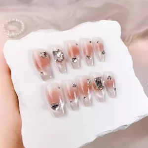 Pink gradient cat eye handmade press-on nails with sparkling rhinestones and heart gems