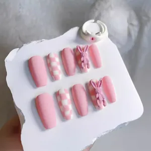 Pink and white checkerboard handmade press-on nails with cute rabbit charms and ring
