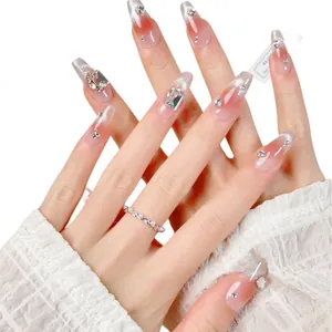 Handmade press-on nails with pink cat eye gradient and sparkly luxury rhinestones