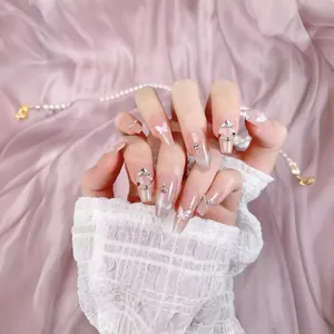 Handmade ballerina press-on nails with 3D crystal butterflies and cat-eye blush finish