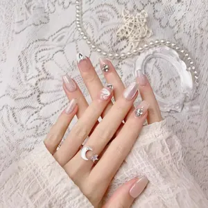 Handmade press-on nails with white swan art, cat-eye shimmer, and luxury rhinestones