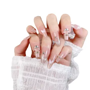 Pink cat eye press-on nails with 3D crystal butterflies and pearl rhinestone charms