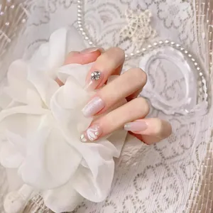 Handmade press-on nails with white swan design, cat-eye shimmer, and rhinestone accents