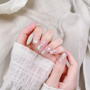 Ice-blue cat eye press-on nails with silver gradient, pearls, and crystals in coffin shape
