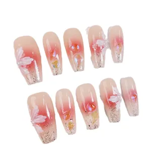 Handmade pink blush press-on nails with 3D floral accents, pearls and silver glitter decor
