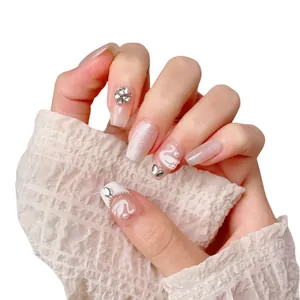 Handmade French swan cat-eye press-on nails with glitter rhinestones in long coffin shape