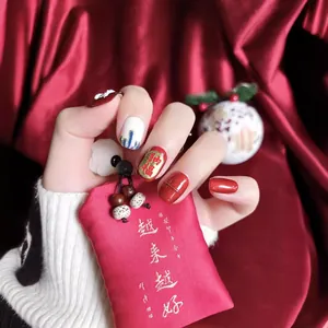Handmade Chinese style press-on nails featuring lion dance design and festive red gold motifs
