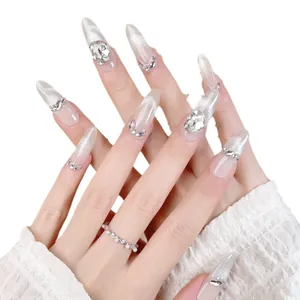 Luxury almond press-on nails with cat eye gradient and 3D rhinestones on white lace