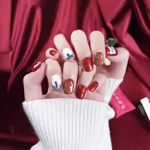 Handmade red Chinese Lion Dance press-on nails with lucky charms and gold 3D patterns