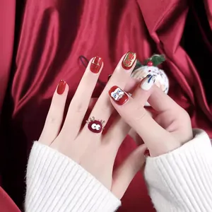 Festive red handmade press-on nails with golden Fu character and lion dance theme
