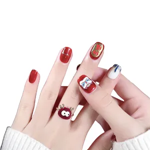 Festive Chinese style red and white press-on nails with lion dance and lucky charm 3D art
