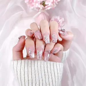 Pink cat-eye handmade press-on nails with luxury coffin shape and butterfly diamonds