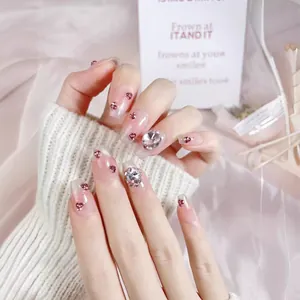 Pink gradient press-on nails with heart rhinestones and sparkling 3D crystal accents