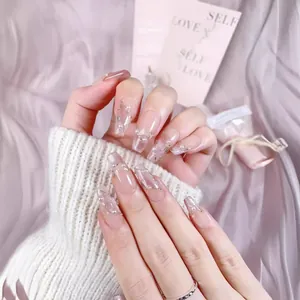 Handmade cat eye press-on nails in nude pink with pearls and elegant gold line detail