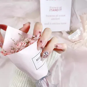 Pink gradient press-on nails with luxury heart rhinestones and silver crystal accents