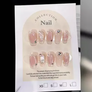 Handmade press-on nails with pink cat eye effect, pearls and shells in coffin shape