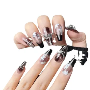 Handmade long coffin press-on nails with black gradient, pearls, and metallic butterfly
