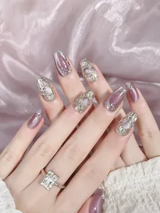 Detailed view of handmade coffin nails with purple cat-eye glitter and 3D silver accents