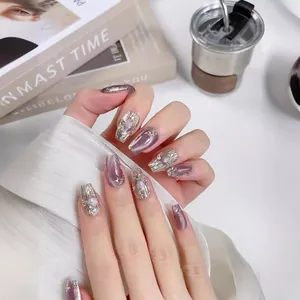 Handmade lavender cat-eye press-on nails with silver foil, pearls, and crystals in long coffin shape