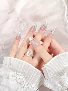 Macro shot of French crystal cat-eye press-on nails with pearls and rhinestones