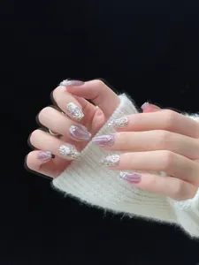 Detailed view of handmade lavender cat-eye press-on nails with silver metallic 3D lines