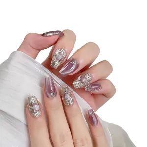 Handmade light purple cat-eye press-on nails with silver metallic accents and rhinestones