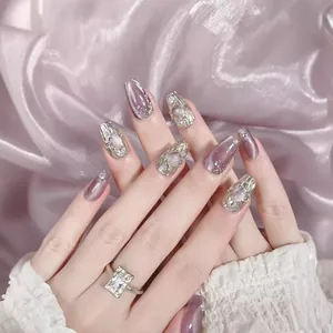 Handmade pink purple cat eye press-on nails in long coffin shape with silver 3D accents