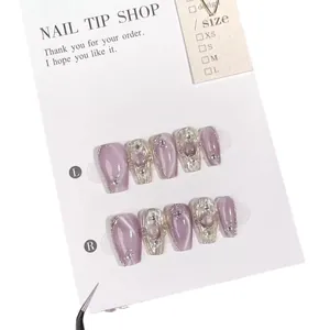 Handmade lavender cat-eye press-on nails with silver metallic relief and pearl accents