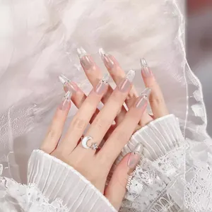 Long French cat eye press-on nails with silver glitter tips and rhinestone accents