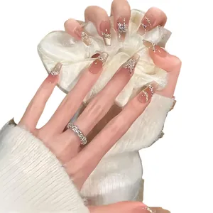 French style press-on nails with brown gradient finish and 3D crystal butterfly accents