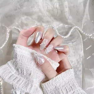 Handcrafted pearl white press-on nails with silver mermaid tail 3D lines and small pearls