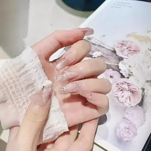 Handmade coffin press-on nails with nude pink cat eye effect and butterfly pearl accents