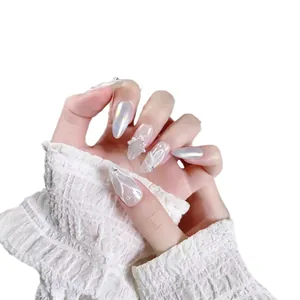 Handmade almond press-on nails with silver cat-eye finish, 3D butterfly wings and pearls