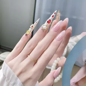 Exquisite handmade long stiletto press-on nails with pink base and silver crystal jewelry
