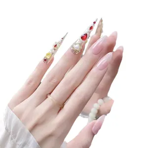 Handmade gradient pink press-on nails with luxury gold flowers and red gemstones