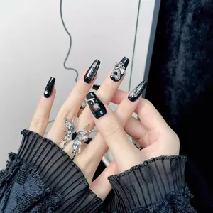 Dark Y2K handmade press-on nails with silver butterfly ring and sparkling crystals