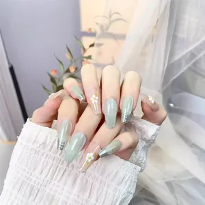 French coffin cat eye press-on nails with silver metal edges and 3D floral accents