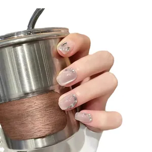 Sparkling crystal cat-eye press-on nails with silver glitter and rhinestones on hand