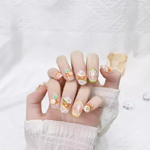 Handmade press-on nails with cute 3D lemon and orange fruit slices and mini rhinestones