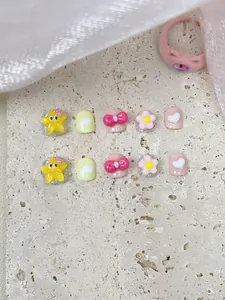 Detail of 10pcs handmade press-on nails for girls with 3D stars and pink bow designs
