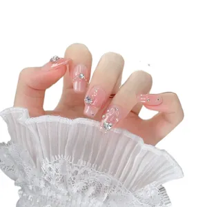 Handmade coffin almond nails in translucent pink jelly with silver hearts and pearls