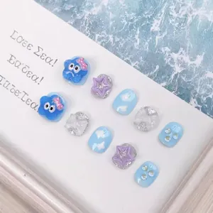 Handmade ocean themed cartoon fake nails with blue bows and glitter stars for kids