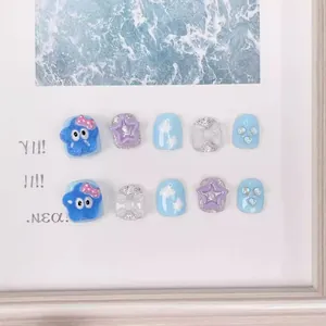Handmade cute cartoon press-on nails for kids with 3D stars and bows in blue and purple